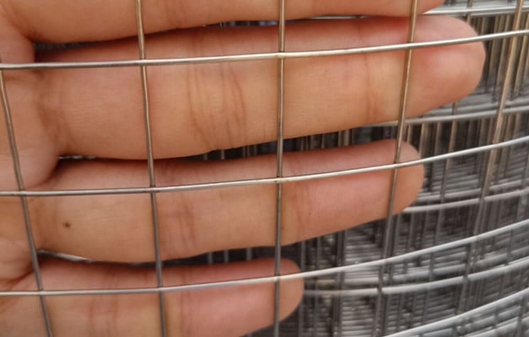 Coarse square welded wire mesh with visible weld intersections