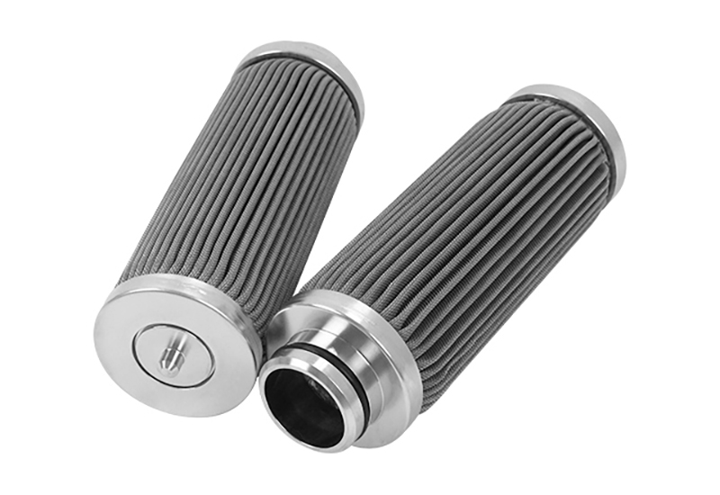 Two compact pleated stainless steel filter cartridges with machined end hardware