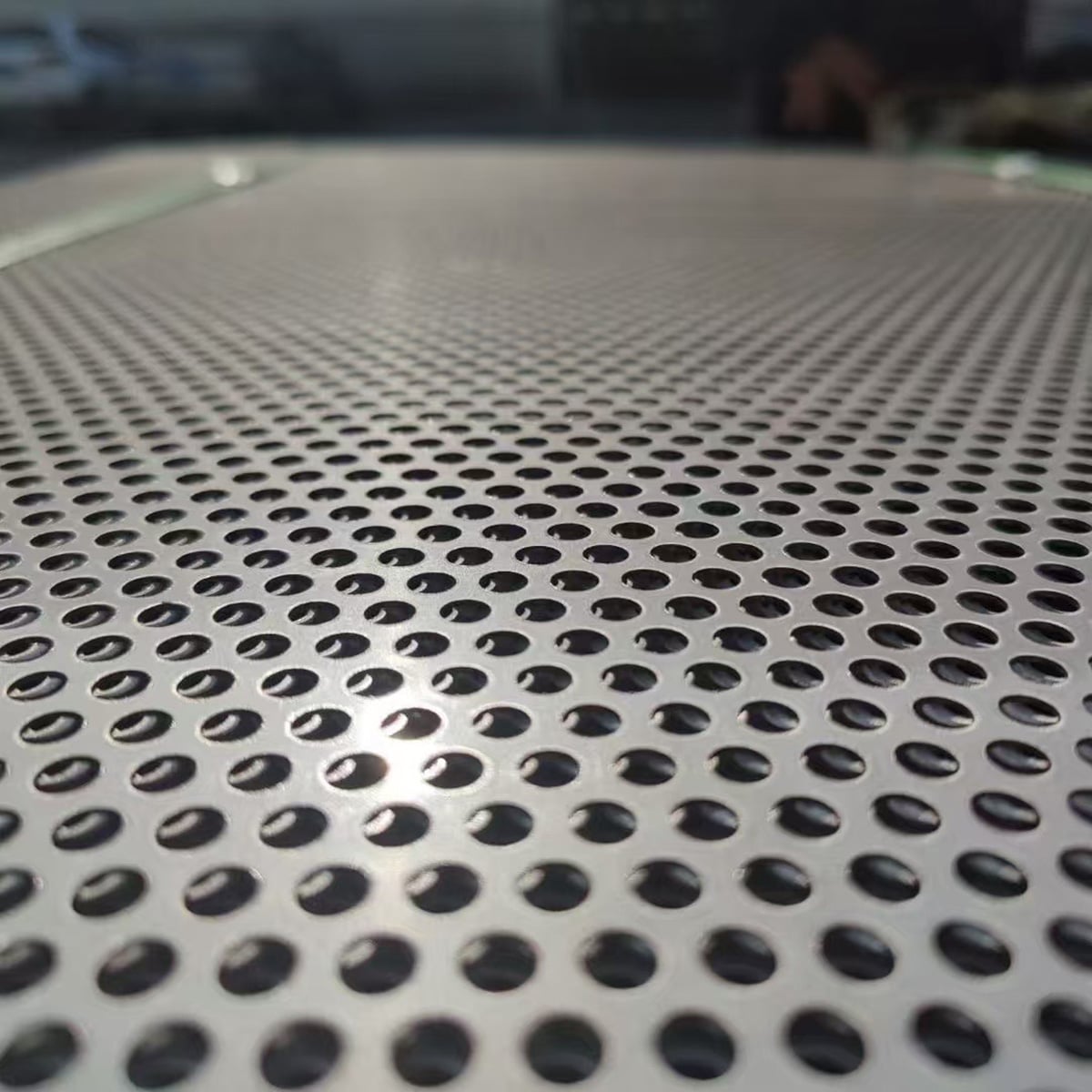 Close-up of fine round hole perforated metal sheet