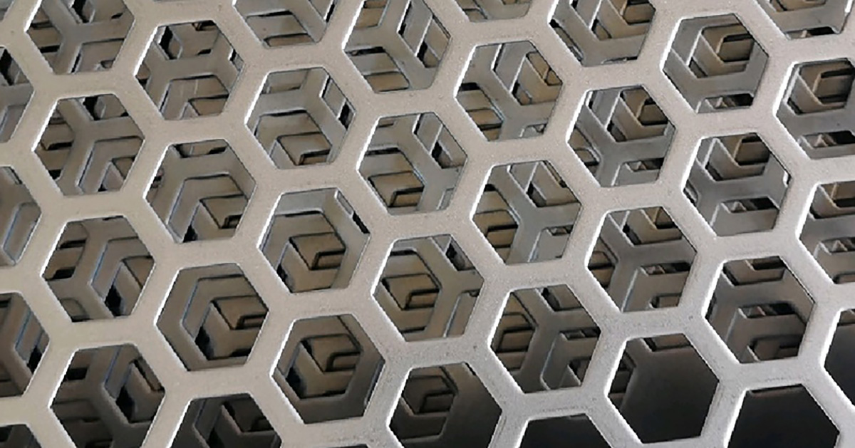 Hexagonal hole perforated metal pattern close-up