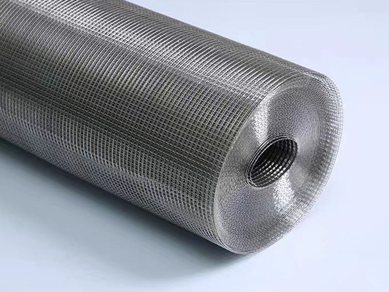 Industrial stainless steel welded wire mesh roll on a clean background