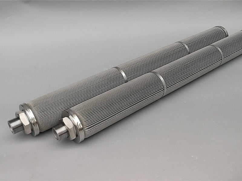 Two long pleated wire mesh filter elements with threaded ends and support rings