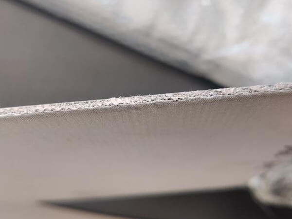 Edge detail showing the bonded layers of sintered stainless steel wire mesh