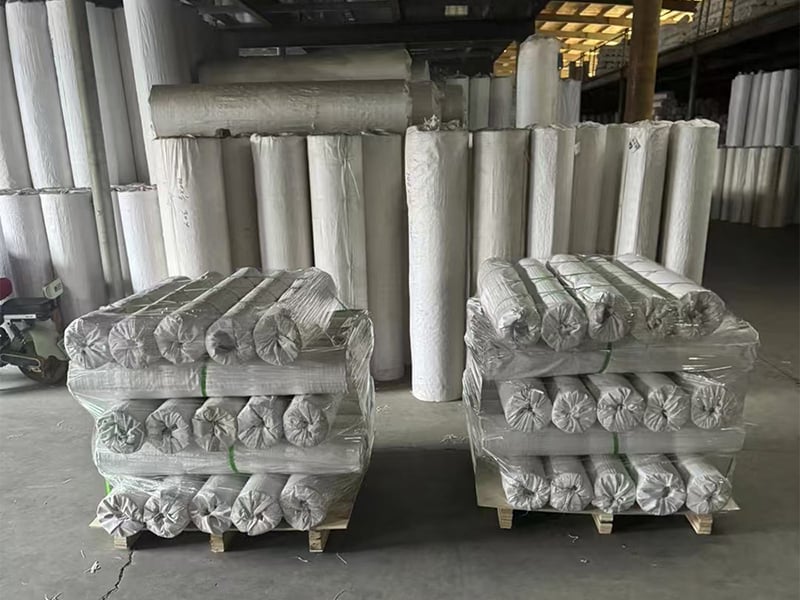Packaged rolls of welded wire mesh prepared for handling