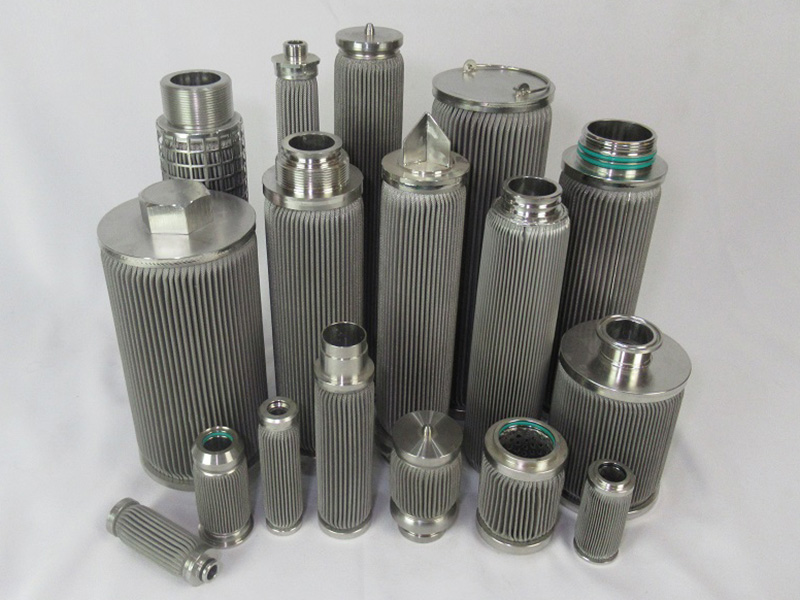 Group of pleated stainless steel filter cartridges with different lengths and end connections