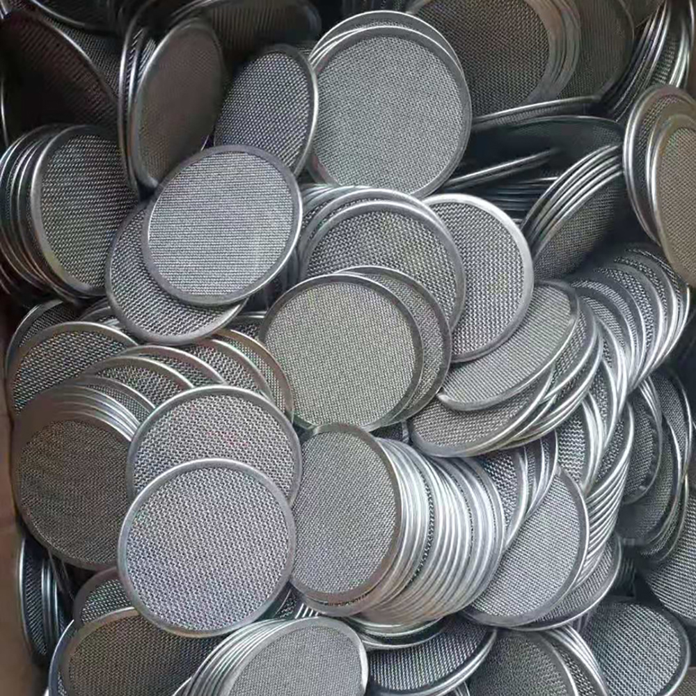 Production batch of round rimmed stainless steel wire mesh filter discs