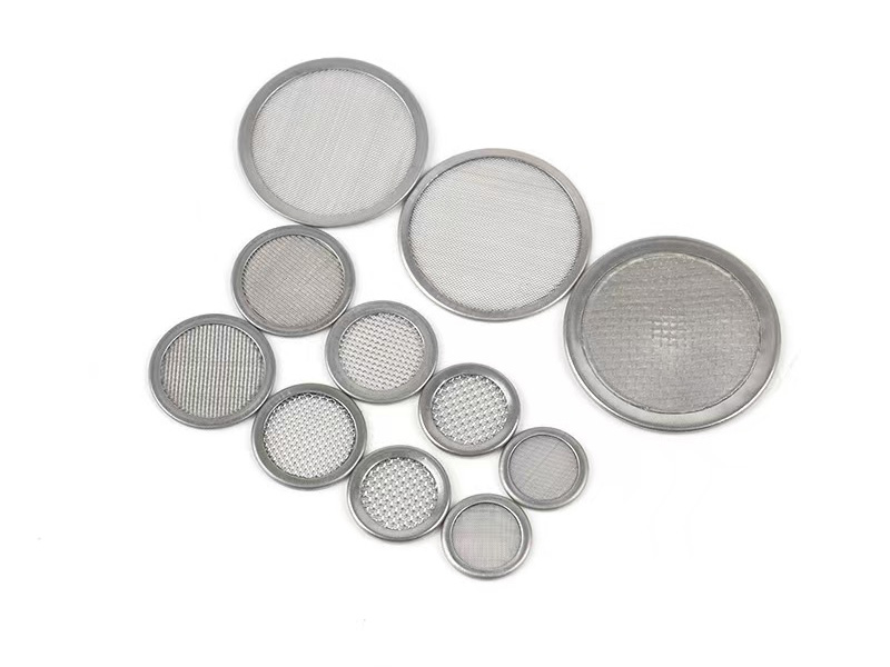 Round metal-rimmed wire mesh filter discs in several sizes and mesh grades