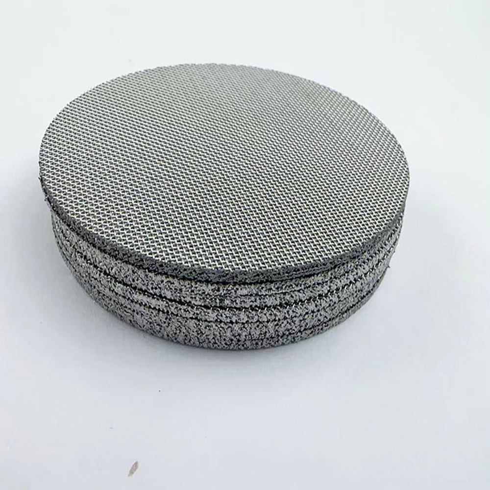 Stack of round stainless steel coffee filter mesh discs